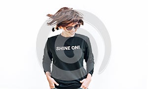 Free feeling happy smiling woman posing in black sweatshirt with positive print Shine On