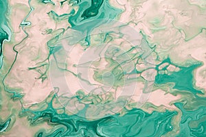 Free flowing beige and green acrylic paint. Abstract marble background or texture. Random Waves and Curls