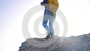 free girl hiker silhouette a with backpack walk mountains. adventure travel teamwork concept. tourist free girl hiker