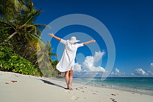Free happy woman on beach enjoying nature. Natural beauty girl o