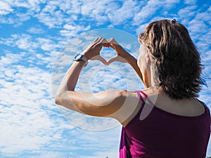 Free happy woman enjoying nature. Beauty girl outdoor. Beauty girl over sky and sun.