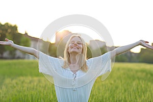 Free happy woman enjoying nature outdoors. Freedom concept.