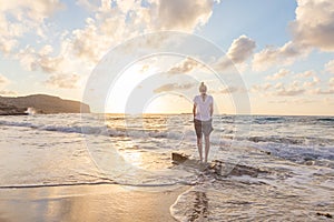 Free Happy Woman Enjoying Sunset on Sandy Beach