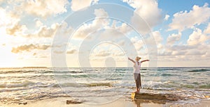 Free Happy Woman Enjoying Sunset on Sandy Beach