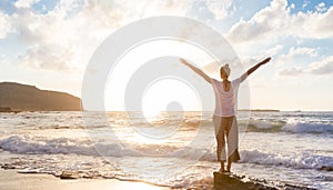 Free Happy Woman Enjoying Sunset on Sandy Beach