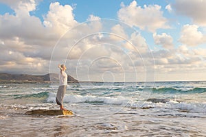 Free Happy Woman Enjoying Sunset on Sandy Beach