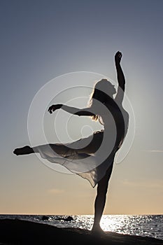 free happy woman silhouette at seaside