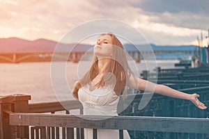 Free happy young woman enjoying nature