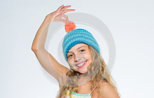 Free knitting patterns. Childrens knitted hats. Girl long hair happy face white background. Kid wear warm soft knitted