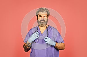 Free medicine concept. Professional doctor. Insurance. Stay healthy. Doctor with stethoscope at hospital. Bearded man