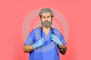 Free medicine concept. Professional doctor. Insurance. Stay healthy. Doctor with stethoscope at hospital. Bearded man