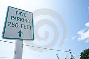 Free Parking Sign, alerts drivers to parking spaces free of charge in 250 feet