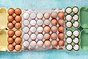 Free range organic  chicken eggs in various cardboard colored egg trays