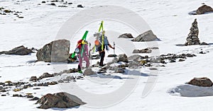 Free-riders ski climbers at the mountain summit