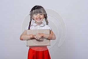 Free shipment, sale. Happy little kid with cardboard box. Cute child toddler clients receiving carton package.