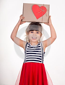 Free shipment, sale. Happy little kid son with cardboard box. Cute child toddler clients receiving carton package.