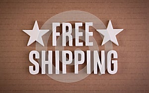 Free Shipping sign lettering words on cardboard