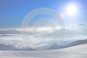 Free Ski Slope in the Ukrainian Carpathian Mountains. Sun Rising over Hoverla Mountain, Highest Point of Ukraine