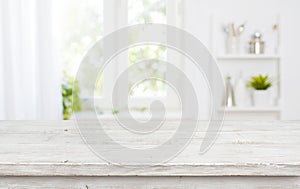 Free space table top background on blurred kitchen window interior