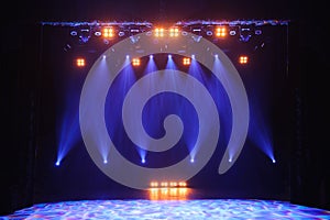 Free stage with lights, background of empty stage, spotlight, neon light, smoke.