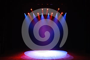 Free stage with lights, background of empty stage, spotlight, neon light, smoke.