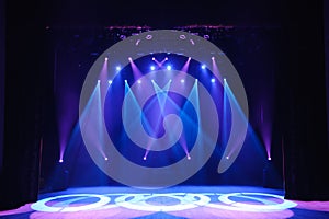 Free stage with lights, background of empty stage, spotlight, neon light, smoke.