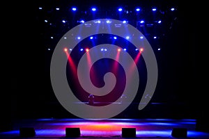 Free stage with lights, background of empty stage, spotlight, neon light, smoke.