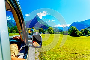 Free summer car travelling road trip in beautiful mountain landscape photo