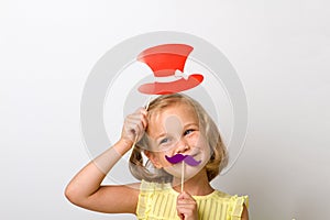 Free time for fun. Close up portrait small girl with fake mustache with plump