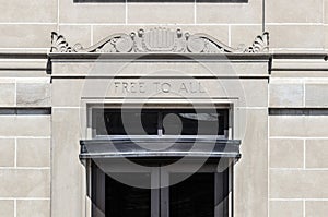 FREE TO ALL text in sandstone library building facade