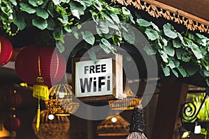 Free Wi-Fi sign hanging in traditional Chinese street restaurant