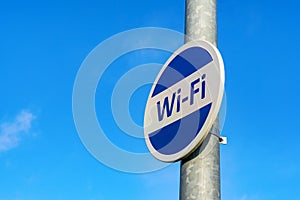 Free WiFi sign against a blue sky