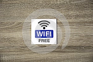 Free WiFi sign on wooden wall