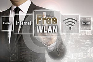 Free wlan businessman with city background concept
