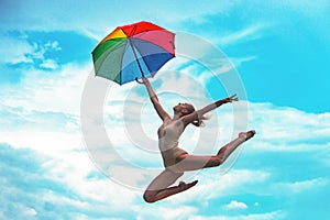 Free woman. Carefree girl outdoor. Freedom concept. Beauty female model jumping over sky. Enjoyment. Jump and enjoy life