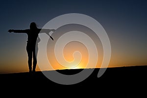 Free woman in a desert photo