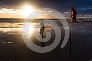 Free woman enjoying freedom feeling happy at beach at sunset. Beautiful serene relaxing woman in pure happiness and