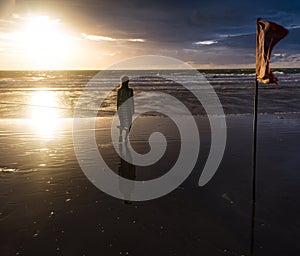 Free woman enjoying freedom feeling happy at beach at sunset. Beautiful serene relaxing woman in pure happiness and