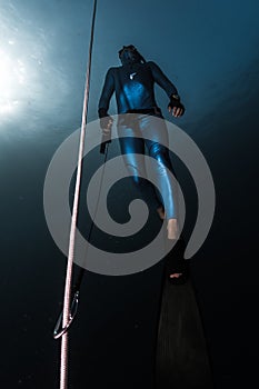 Freediver ascends from a depth