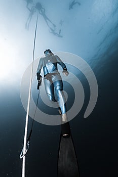 Freediver ascends from a depth