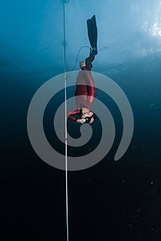 Freediver glides along the rope