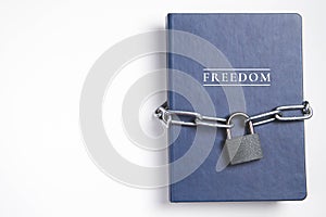 Freedom. Book with lock. A closed book is banned. Chain on the book.