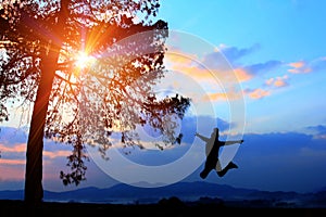 Freedom concept,silhouette women jumping happily in holiday,young teenagers recreation wiht adventure and camping