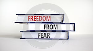 Freedom from fear symbol. Books with words `freedom from fear`. Beautiful white background, copy space. Business, motivational a