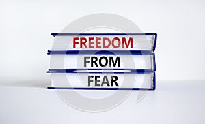 Freedom from fear symbol. Books with words `freedom from fear`. Beautiful white background, copy space. Business, motivational a