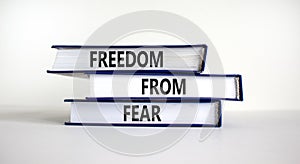 Freedom from fear symbol. Books with words `freedom from fear`. Beautiful white background, copy space. Business, motivational a