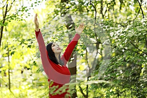 Freedom happy woman feeling alive and free in nature breathing clean and fresh air