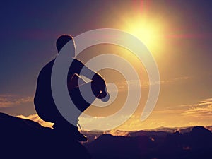 Freedom hiker sit up misty valley and enjoy morning in beautiful nature