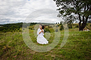 Freedom lifestyle. Carpathians mountain girl. Woman in windy valley. Woman in the mountain valley. Landscape of summer nature.