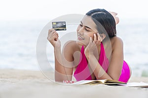 Freedom payment ecommerce and lifestyle travel leisure concept. Enjoy young woman wear pink bikini looking mock up credit card on